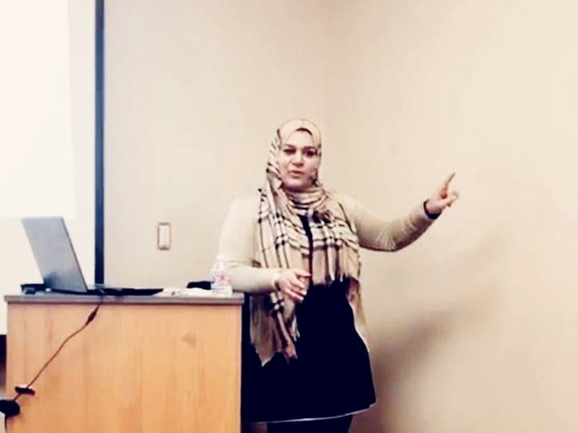 Marriam Ahmed speaking at podium